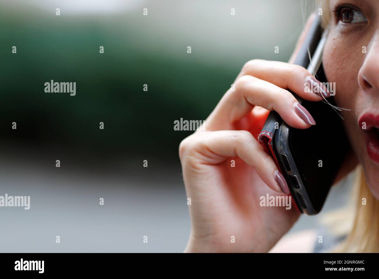Woman using a smartphone.  Italy. Stock Photo
