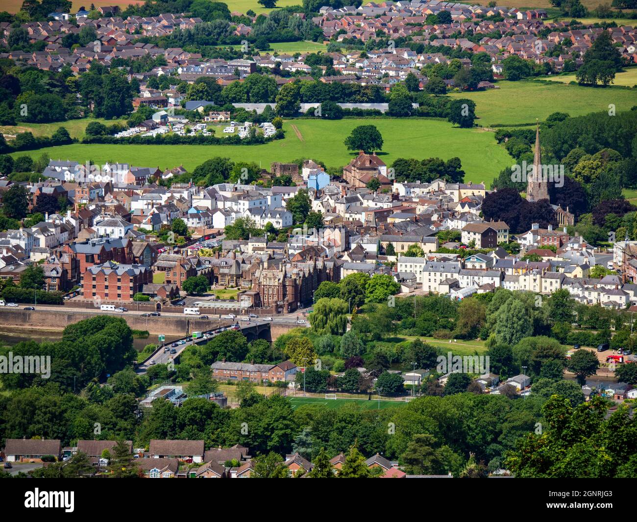 Monmouth, Monmouthshire, Wales UK June 24 2018 Looking down at Monmouth town and jones' Public school and 13th Century Gatehouse Bridge Stock Photo