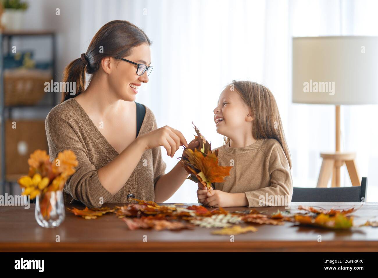 Happy family doing autumn decor. Fall atmosphere Stock Photo