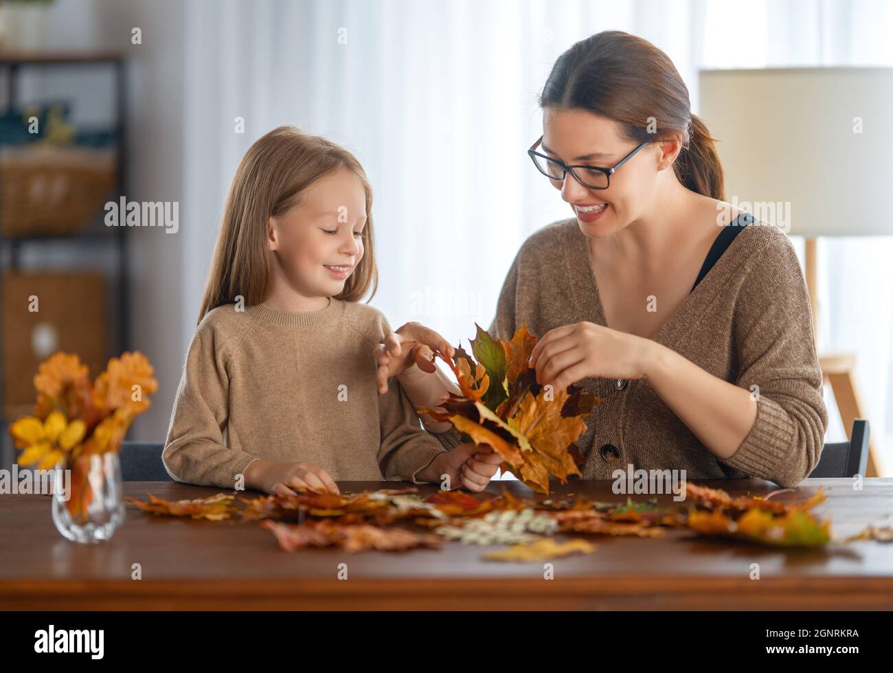 Happy family doing autumn decor. Fall atmosphere Stock Photo