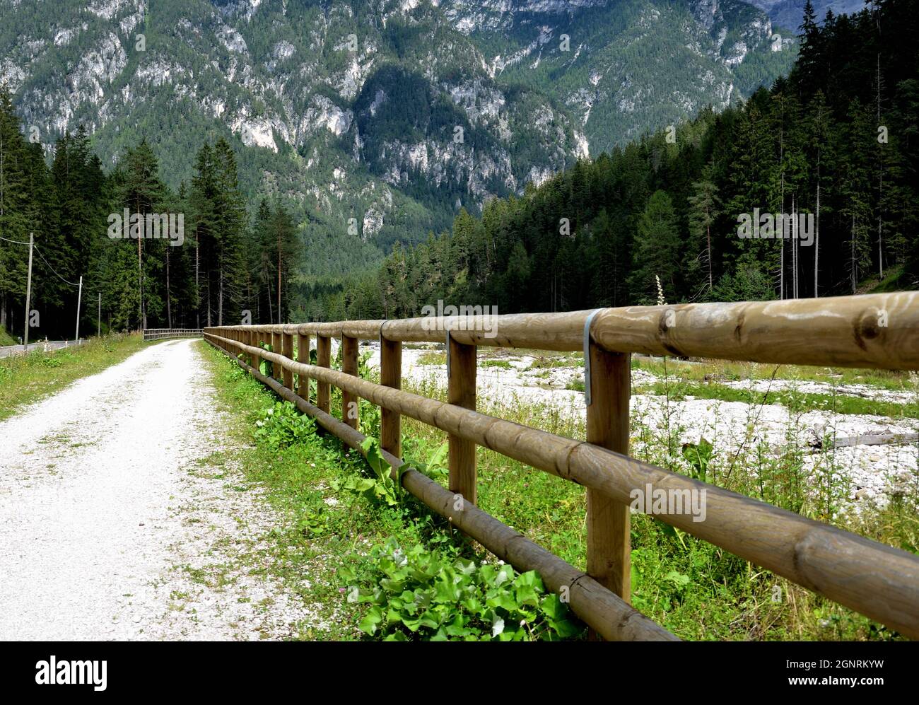 The cycle path that runs along the state road and the Ansiei river a few kilometers from the town of Auronzo Stock Photo