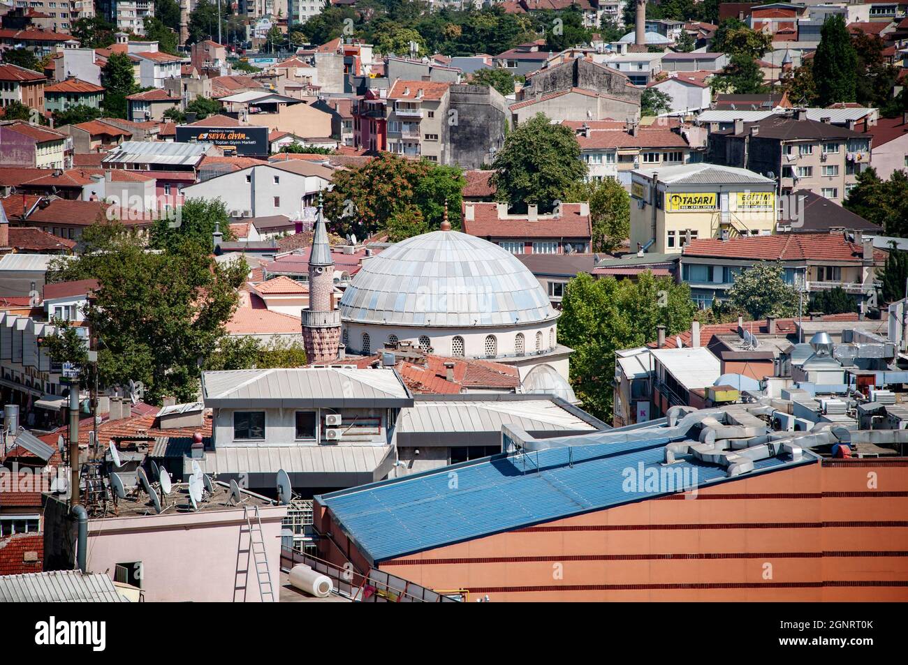 BURSA, TURKEY. AUGUST 15, 2021. Panoramic view to the roofs of buildings and houses. Mosques and towers. Stock Photo