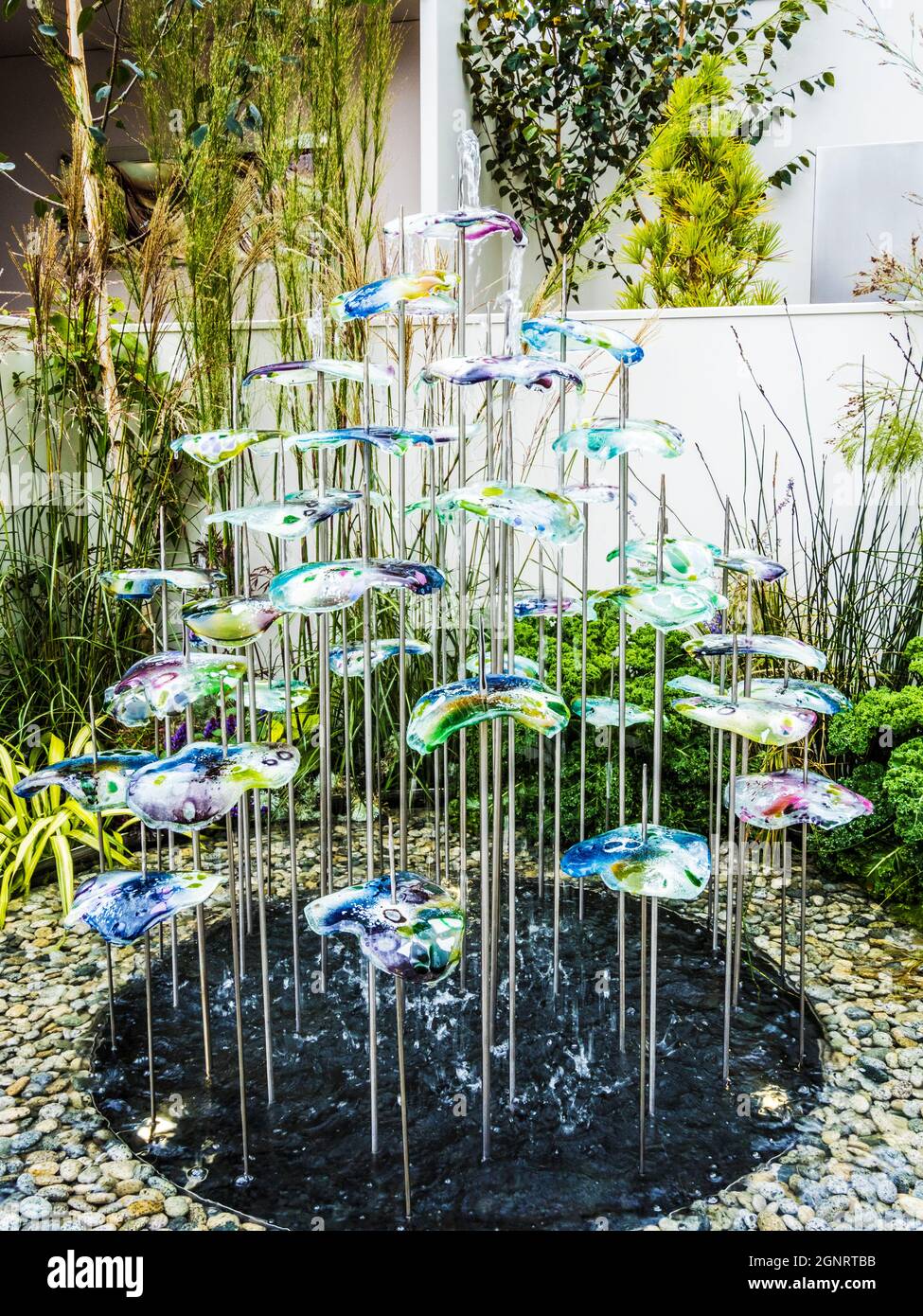 Contemporary glass garden water feature on display at the Chelsea Flower Show. Stock Photo