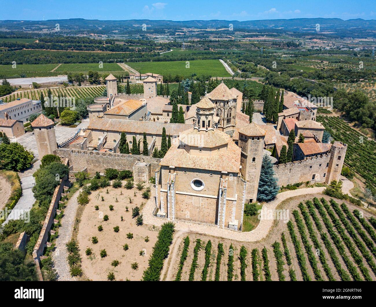 Aerial view of Monastery of Santa Maria de Poblet and surrounding fields in Poblet, Vimbodí, Tarragona, Catalonia, Spain.  This Monastery of Poblet wa Stock Photo