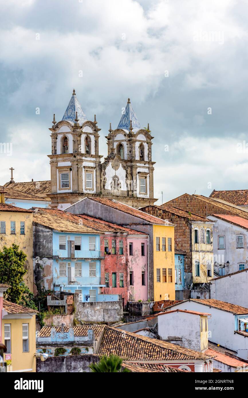 Colorful old and historic district of Pelourinho with cathedral tower on the background. The historic center of Salvador, Bahia, Brazil. Stock Photo
