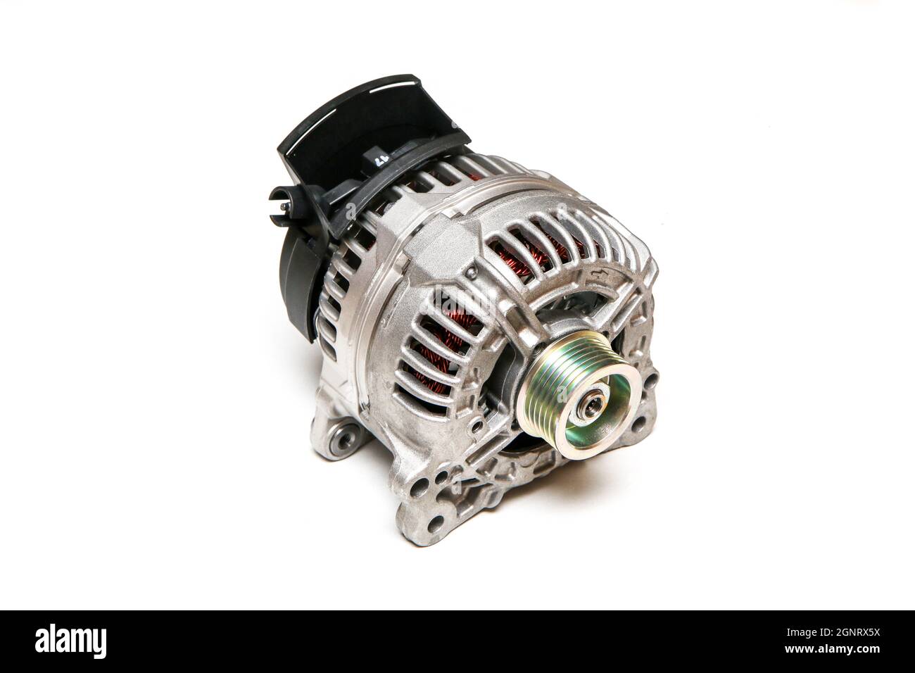The new shiny alternator for the motor vehicle as a spare part to