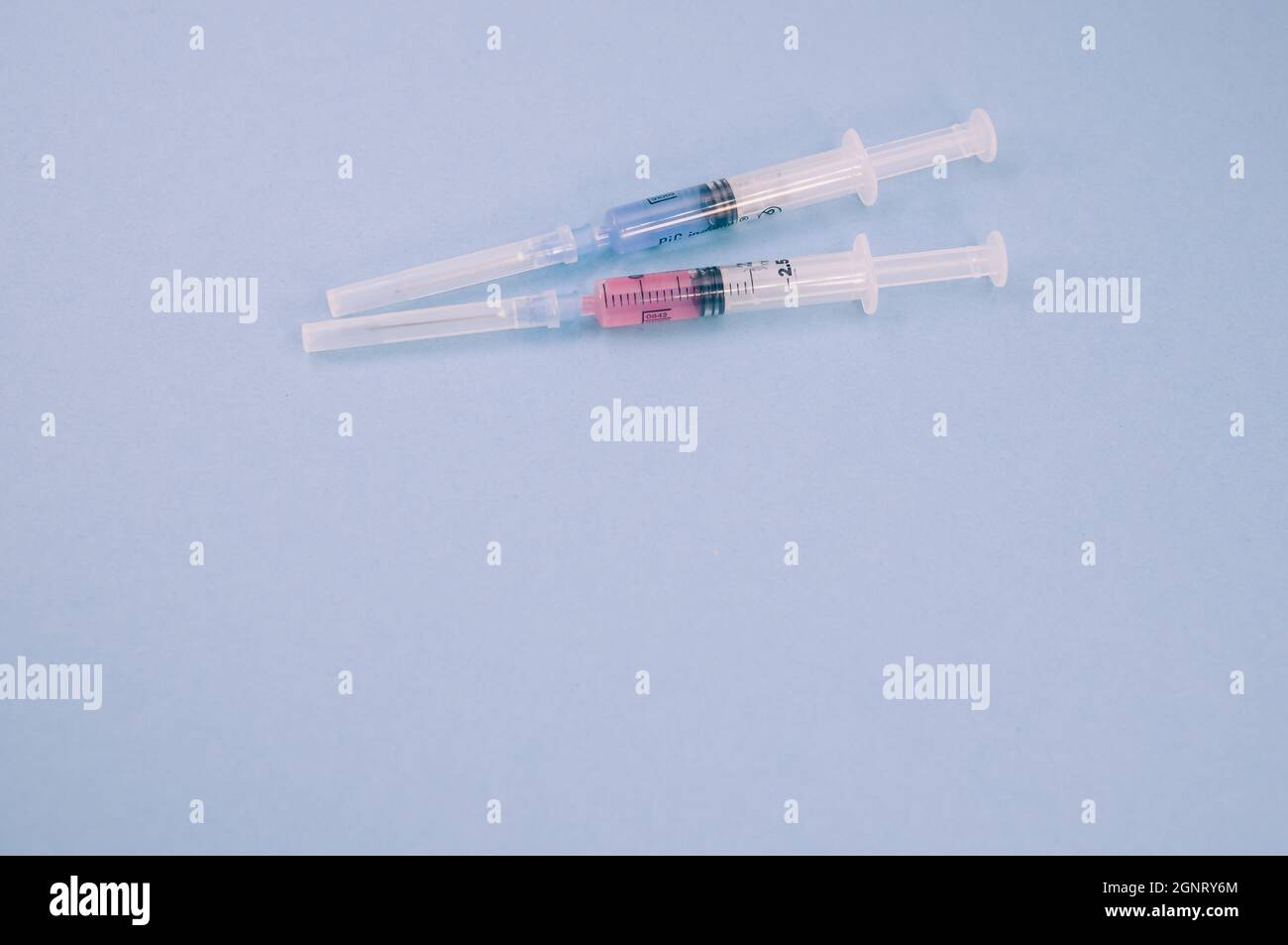 isolated sterilized injection syringes on a blue background Stock Photo Alamy