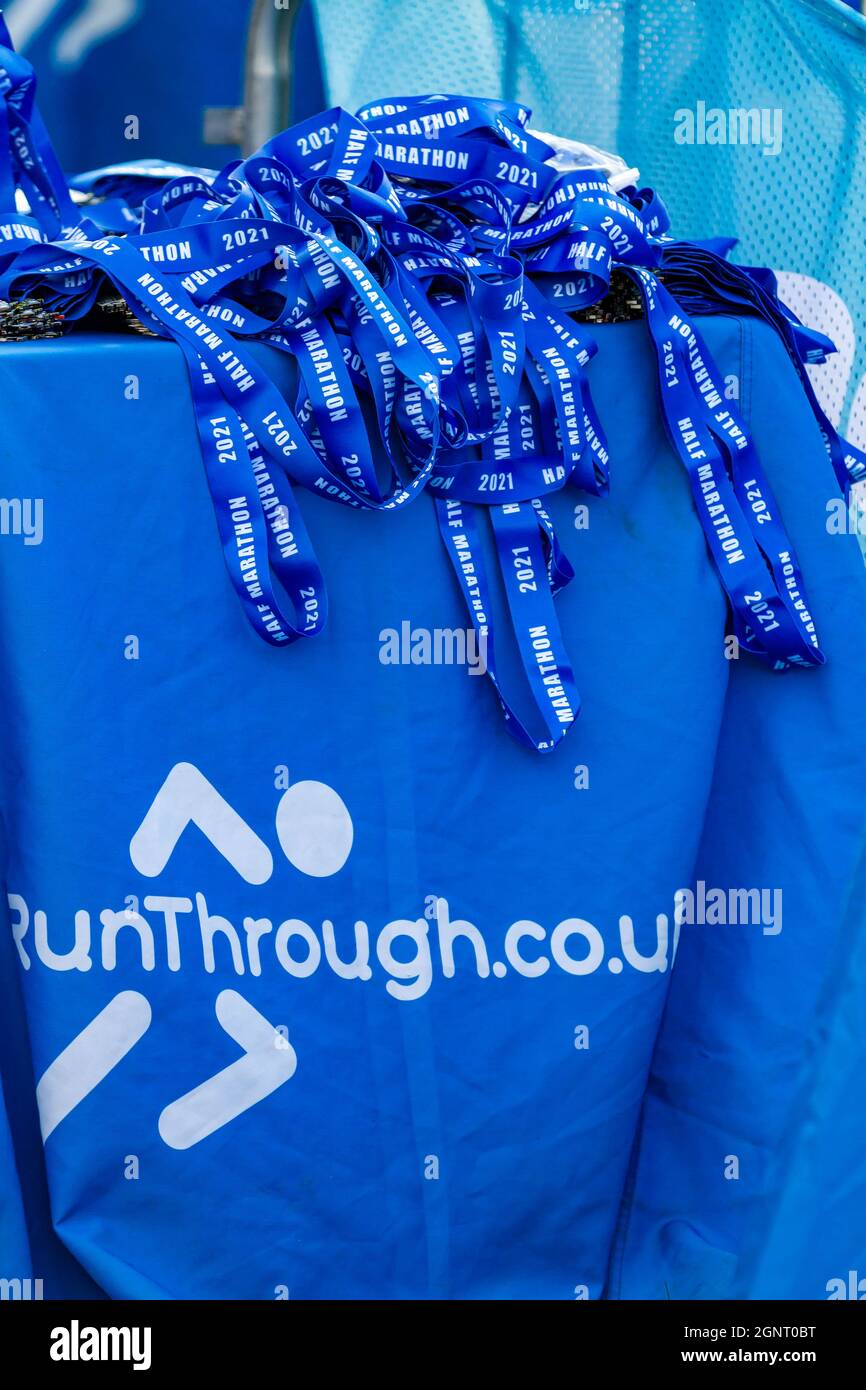 Warrington Running Festival 2021 - table of completion medals with their lanyards Stock Photo