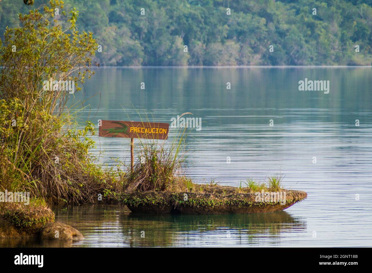 Crocodile warning sign at Laguna Lachua lake, Guatemala Stock Photo