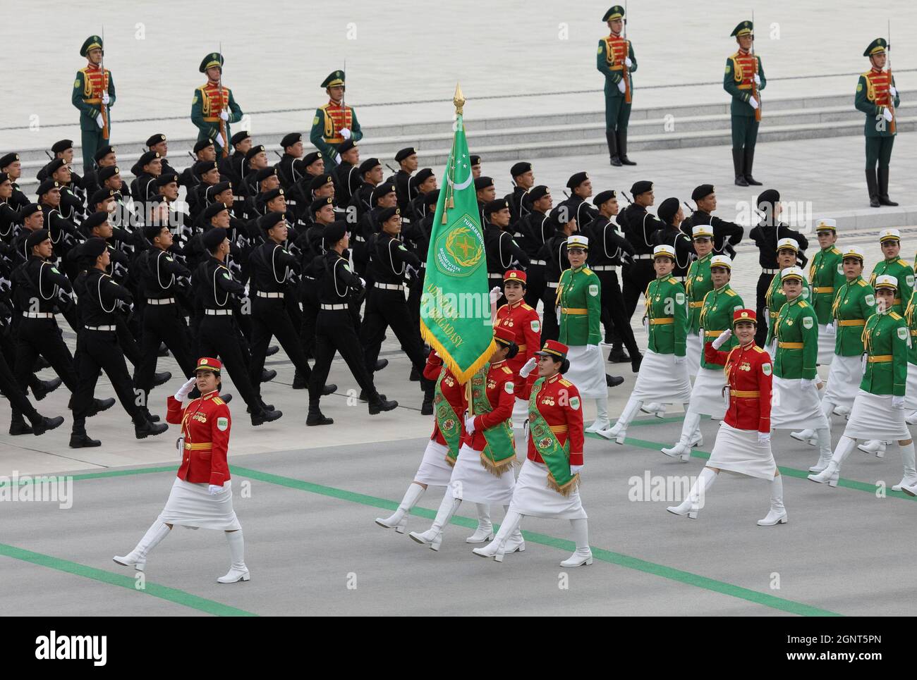 Troops march at a parade marking the Independence Day in Ashgabat, Turkmenistan September 27, 2021. REUTERS/Vyacheslav Sarkisyan REFILE- QUALITY REPEAT Stock Photo