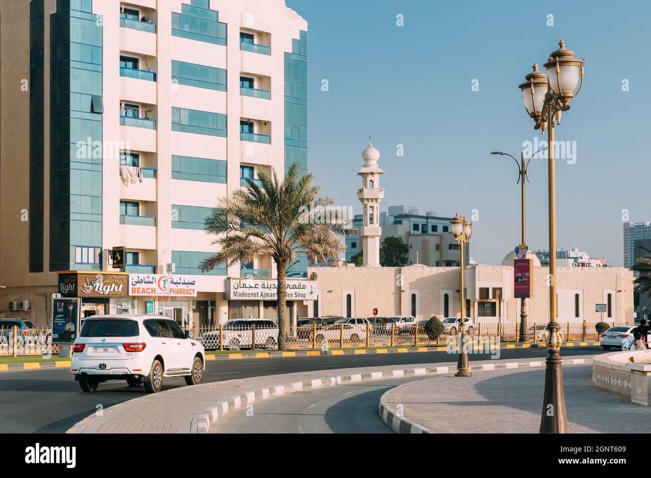 Nissan Patrol Moving In Street Of City Of Ajman Stock Photo