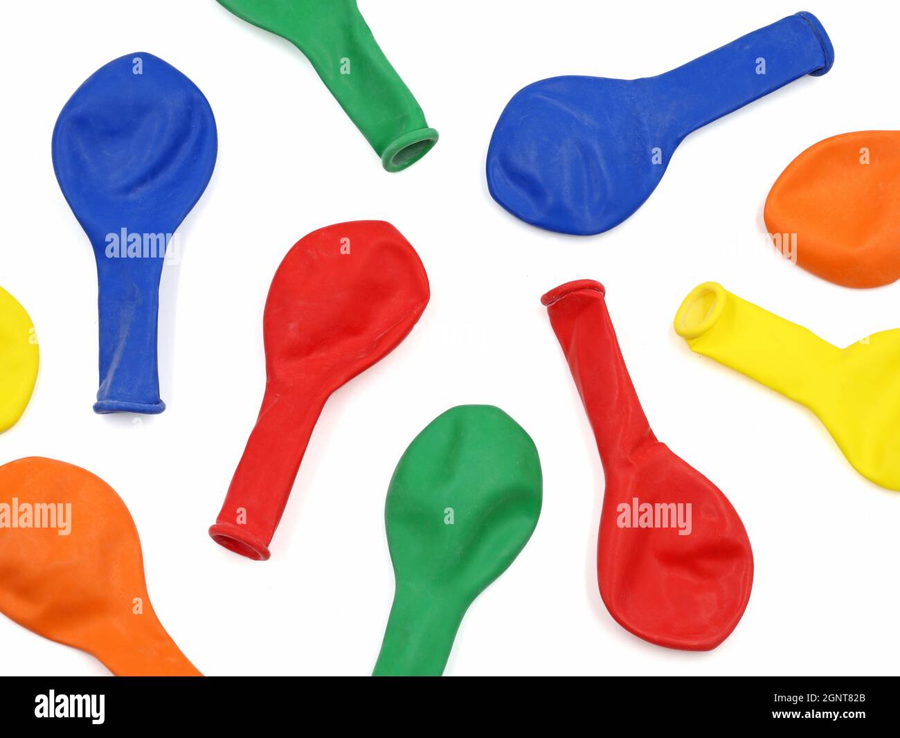 top view of deflated colorful balloons on white background Stock Photo ...
