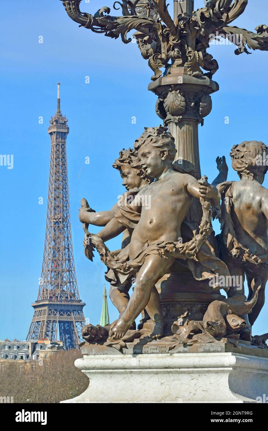 France, Paris, area listed as World Heritage by UNESCO, the Alexander III bridge and the Eiffel Tower on the background Stock Photo