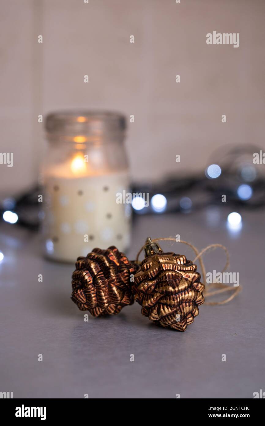 A festive image with a Christmas garland of lights and pine cones. Stock Photo