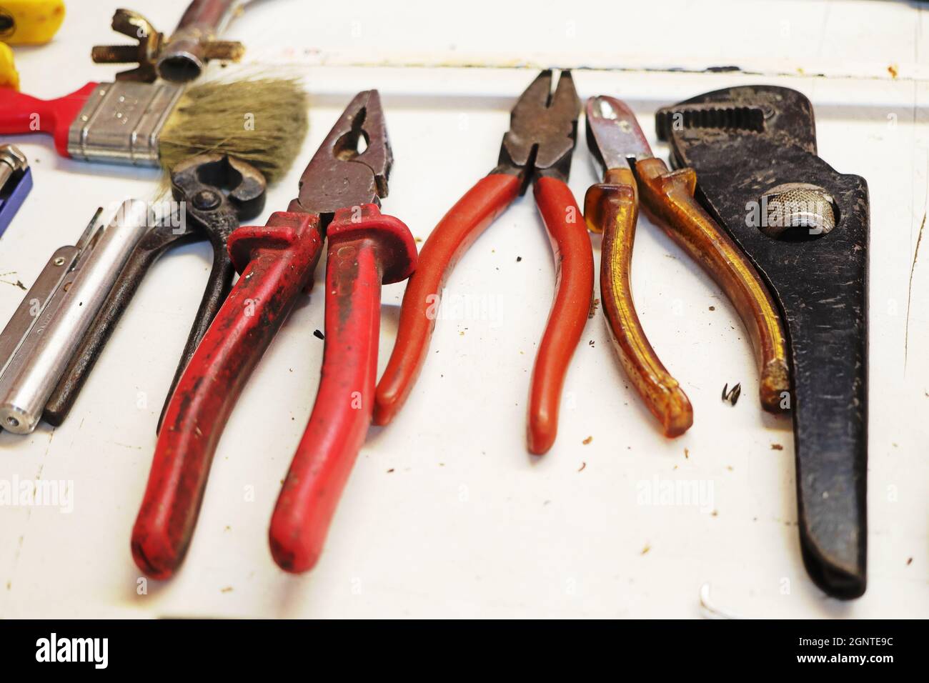 Limassol - Cyprus - September 20, 2021: Colourful tools laid out on white background Stock Photo