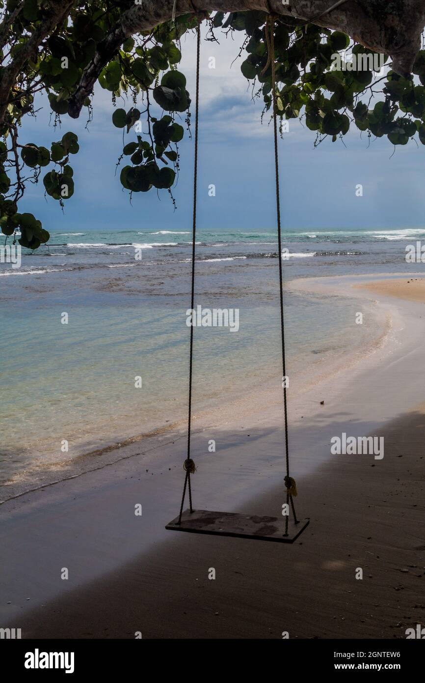 Rope swing on a beach in Puerto Viejo de Talamanca village, Costa Rica Stock Photo