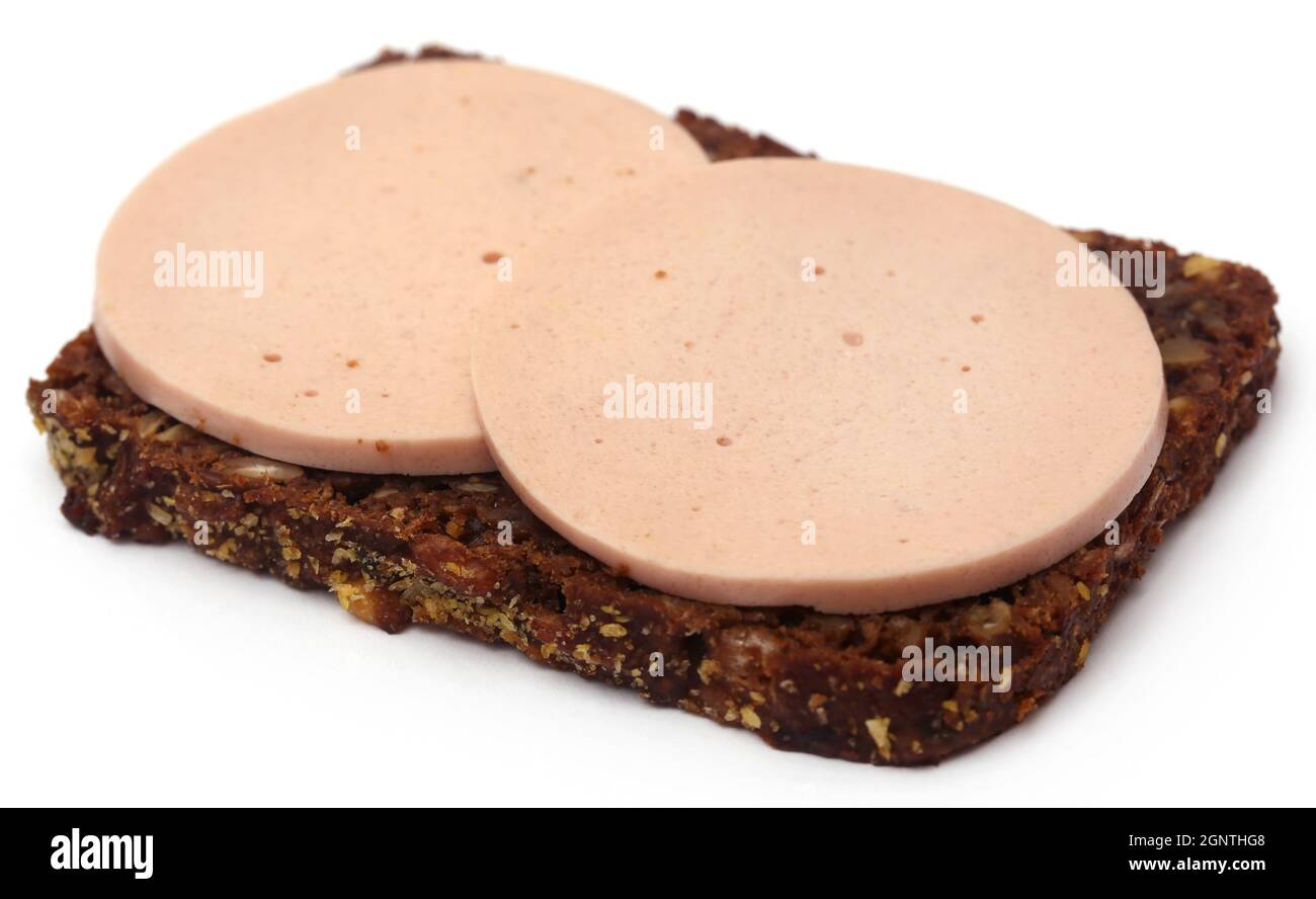 Salami on rye bread over white background Stock Photo Alamy