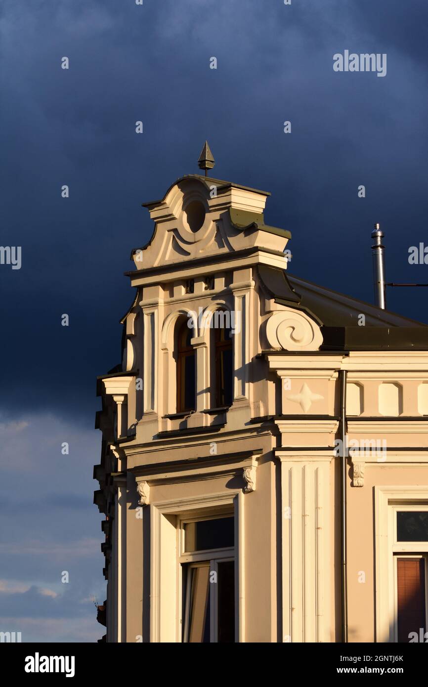 The front of the historic building against the backdrop of severe storm ...
