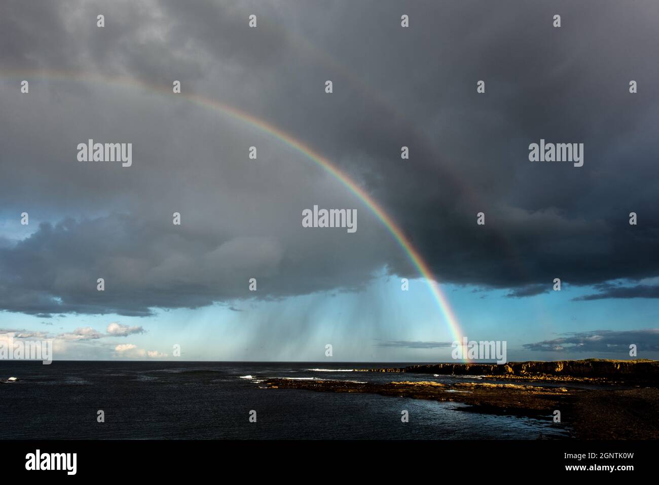 Beadnell, Northumberland, UK. 27th Sep 2021. A rainbow after a passing rain shower over Beadnell, Northumberland. Neil Squires/Alamy Live News Stock Photo