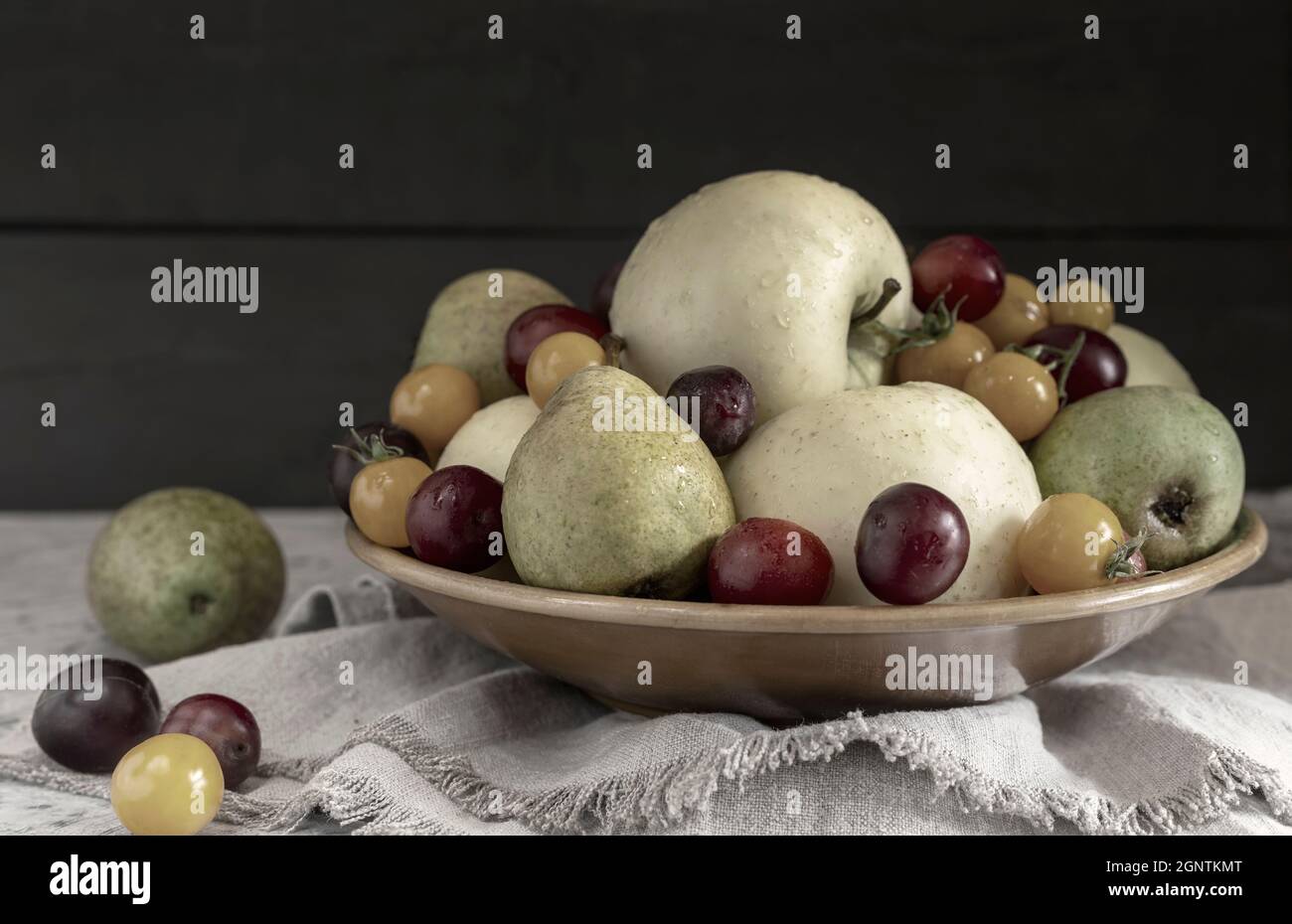 Still life: fruit in a ceramic plate Stock Photo