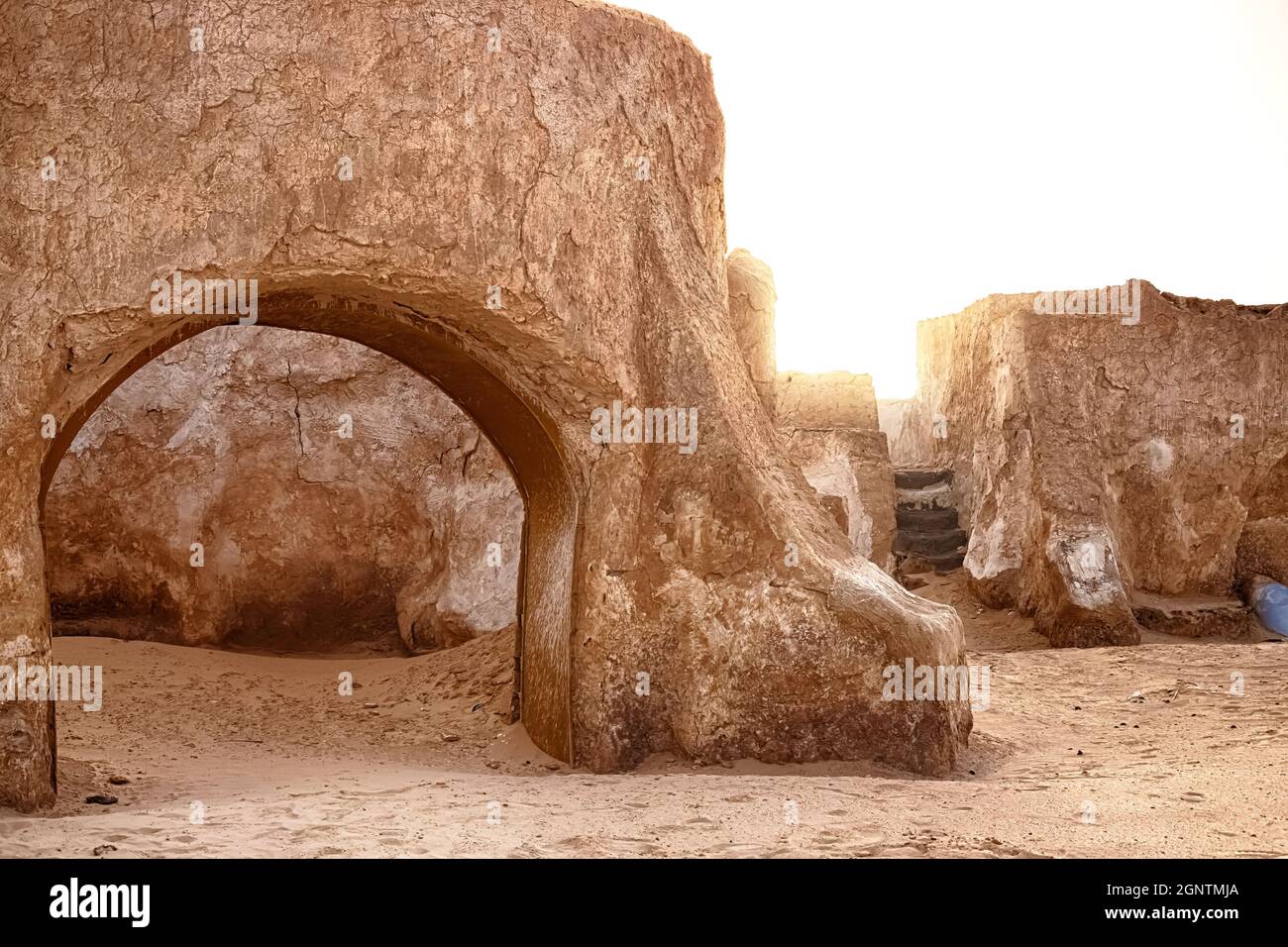 Abandoned set for the filming of Star Wars movie in the Sahara Desert against the backdrop of sand dunes. Stock Photo