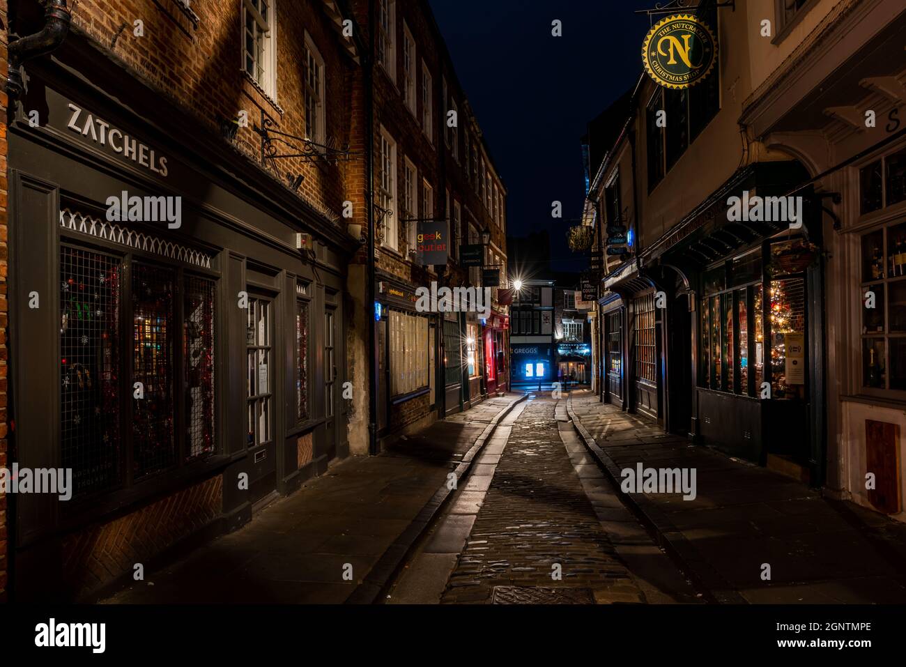 YORK, UK - SEPTEMBER 12, 2021: Night view of the Shambles, a famous tourist attraction lined with historic buildings in the Medieval city of York. It Stock Photo