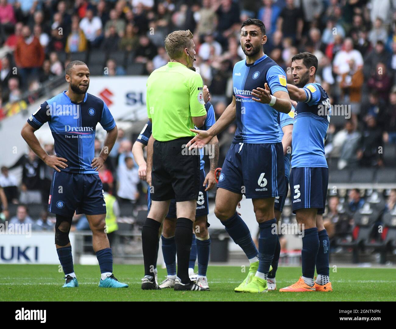 MILTON KEYNES, ENGLAND - SEPTEMBER 25, 2021: Ryan Sirous Tafazolli of Wycombe protests after English referee Scott Oldham awarded MK Dons a penalty during the 2021/22 SkyBet EFL League One matchweek 9 game between MK Dons FC and Wycombe Wanderers FC at Stadium MK. Copyright: Cosmin Iftode/Picstaff Stock Photo