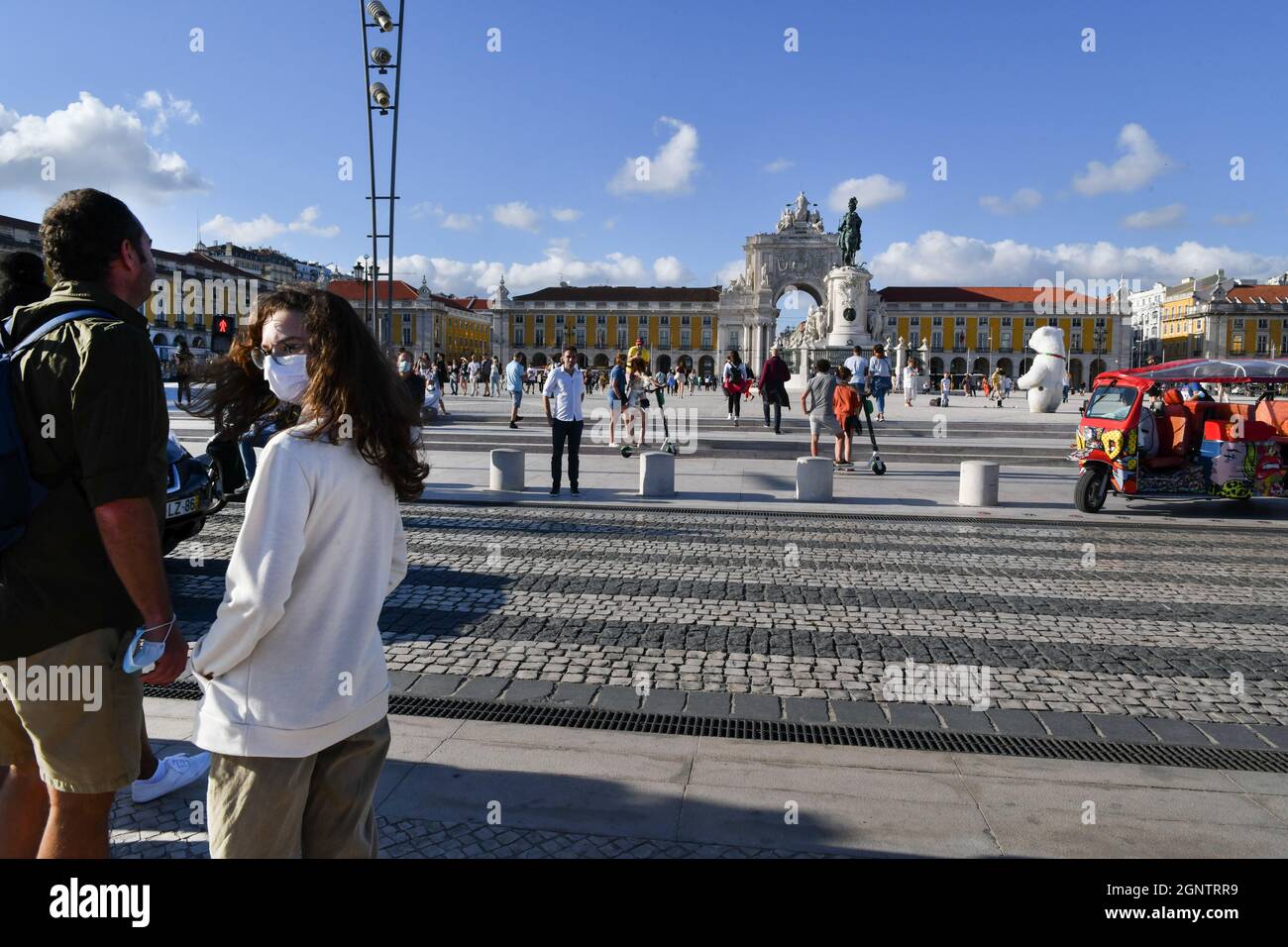 Lisbon, Portugal. 25th Sep, 2021. People wearing facemasks as a precaution against the spread of covid-19 walk around the tourist area of Praça de Comercio amid covid-19 pandemic. Credit: SOPA Images Limited/Alamy Live News Stock Photo