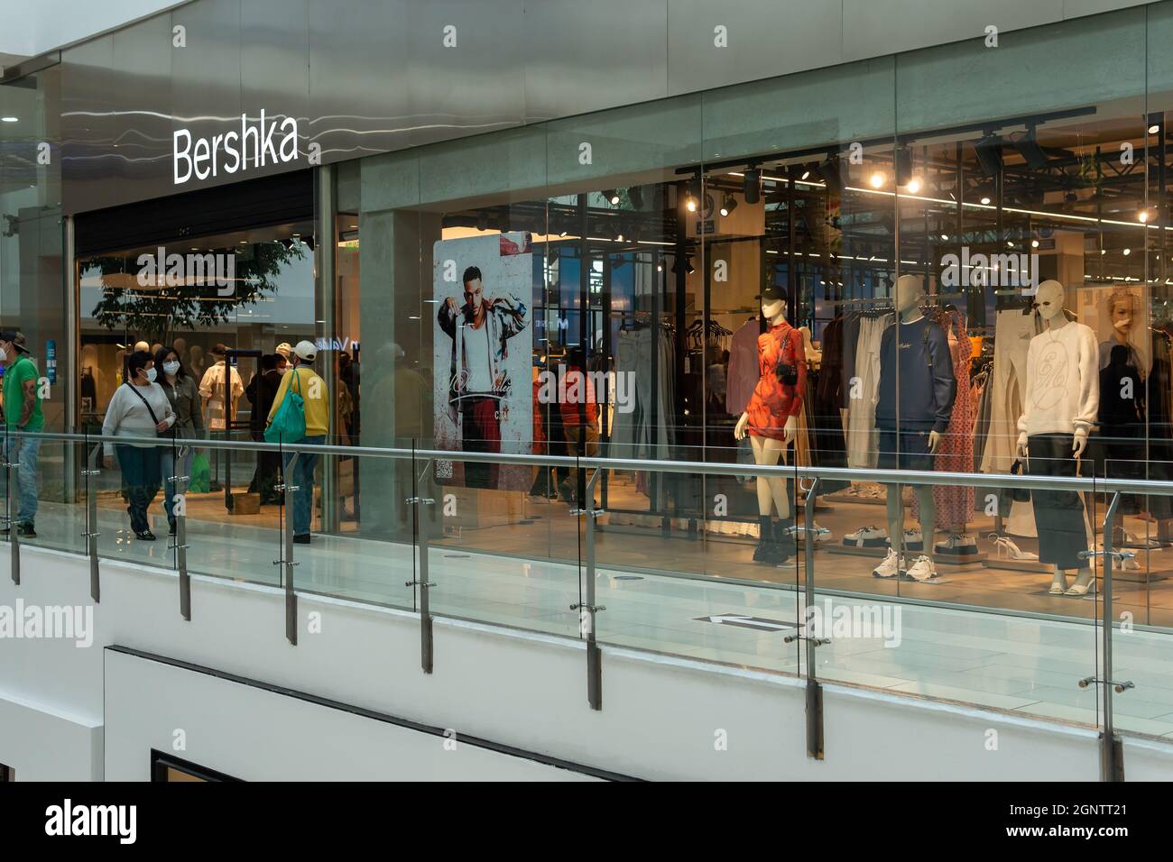 Quito, Pichincha, Ecuador, September 11, 2021. Entrance to Bershka store in Quicentro Shopping Center with people walking with masks Stock Photo