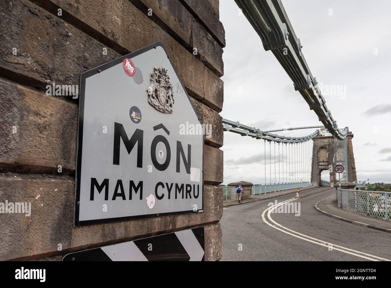 Bangor, UK: Sign on Menai Suspension Bridge - Mon Mam Cymru (Anglesey Mother of Wales) Stock Photo