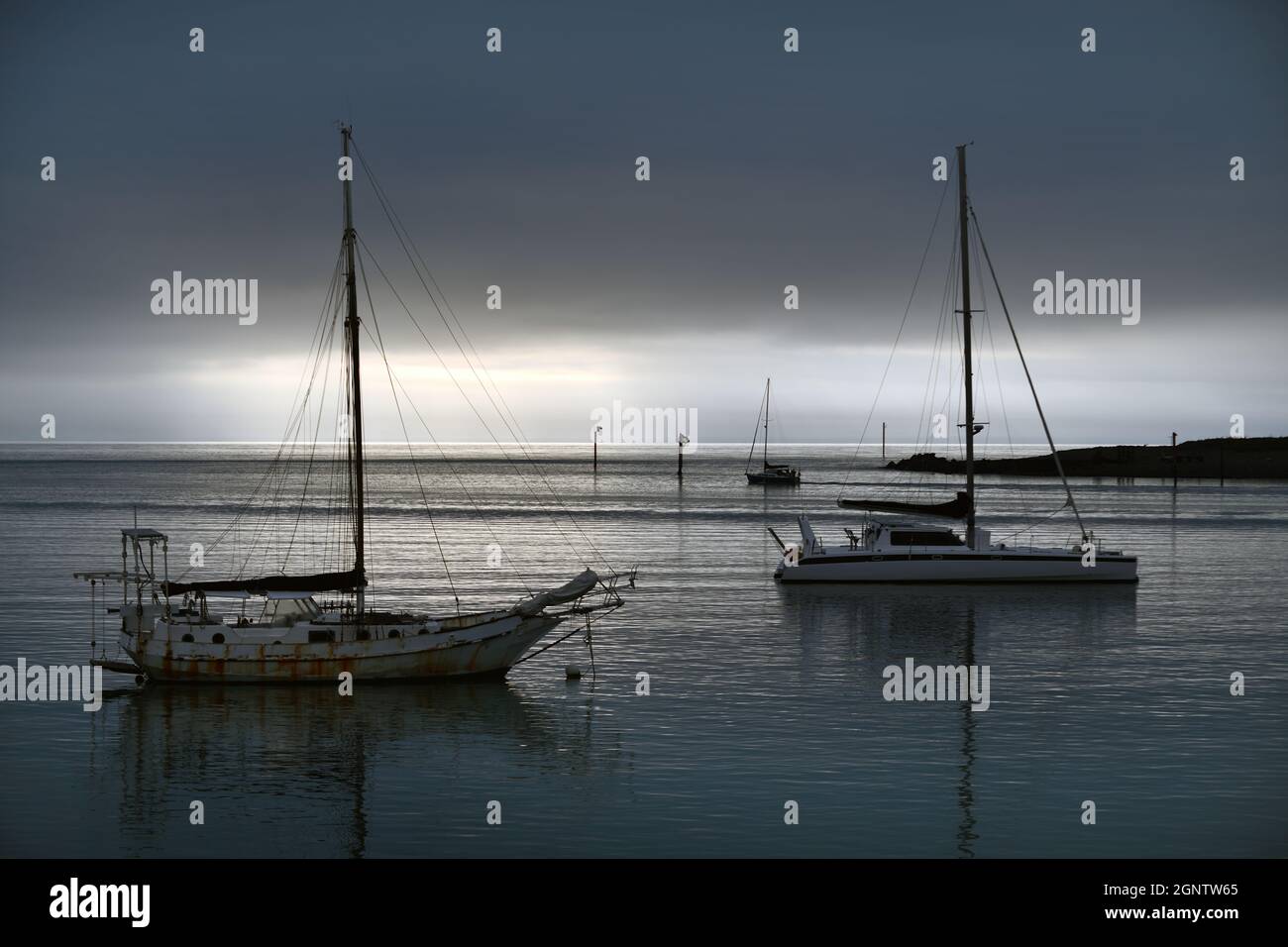 two sail boats rest at their moorings in Nelson, New Zealand Stock