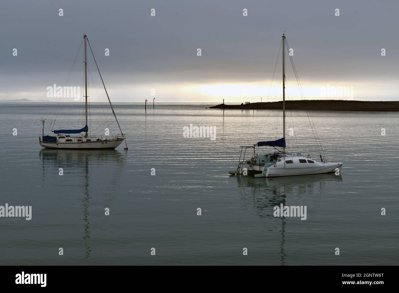 two sail boats rest at their moorings in Nelson, New Zealand Stock