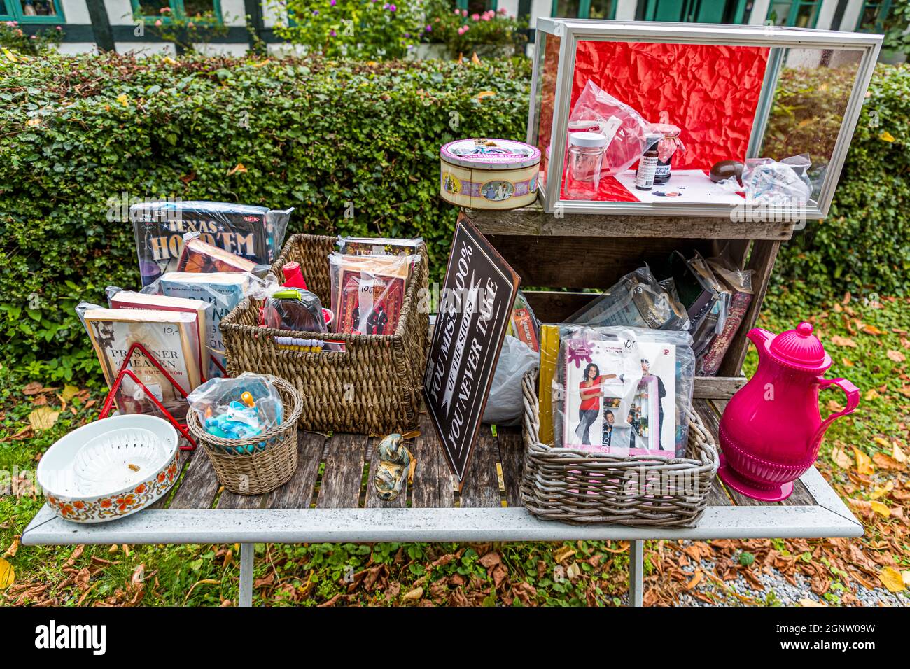 Loppemarked - the flea market is held high on the Danish island of Fyn and the neighboring islands. Books are wrapped in foil as a precaution, because the weather can change quickly here on the coast. Troense, Svendborg, Denmark Stock Photo