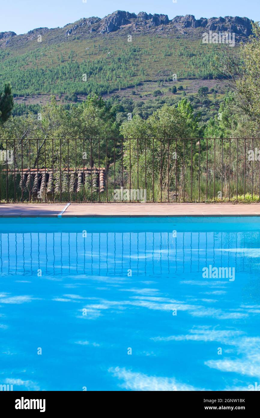 Outdoor pool with mountains as background. Luxurious rural tourism concept Stock Photo