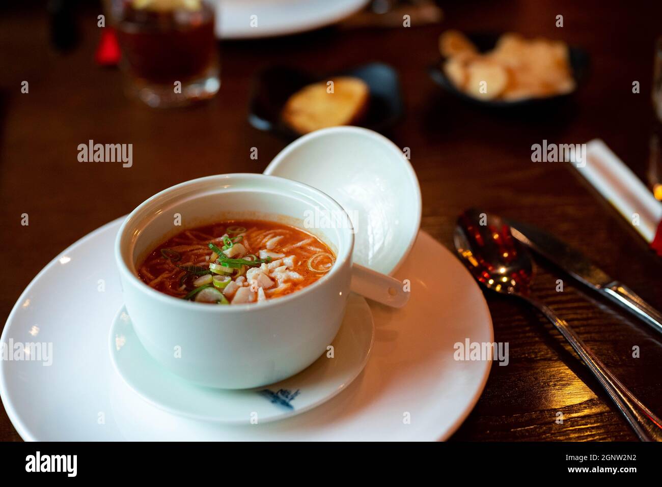 Chinese tomato soup with spring onions in a restaurant Stock Photo Alamy