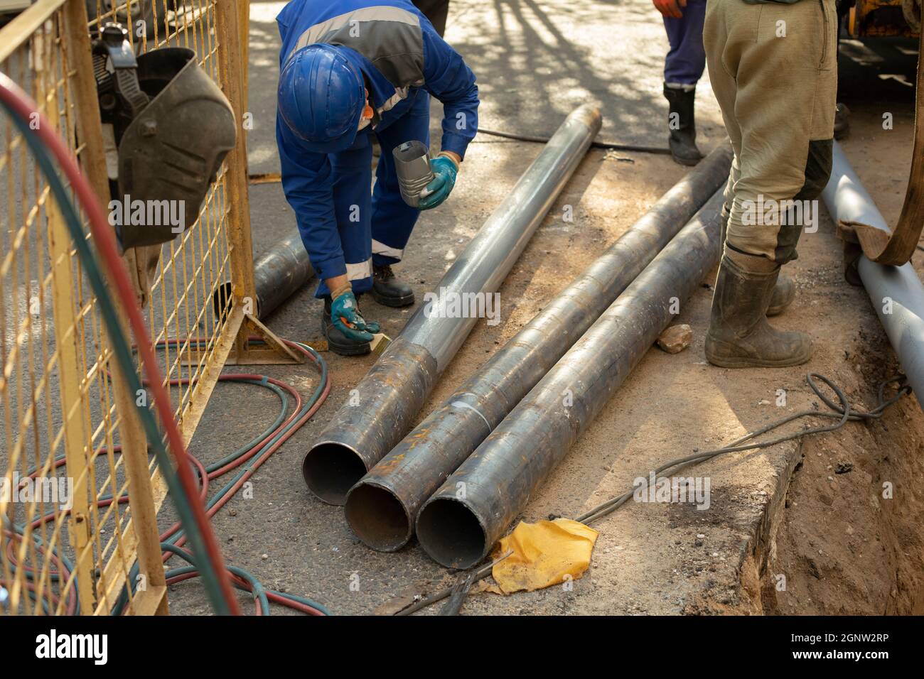 Replacement of sewer pipes. Laying gas pipes in the ground. Workers are