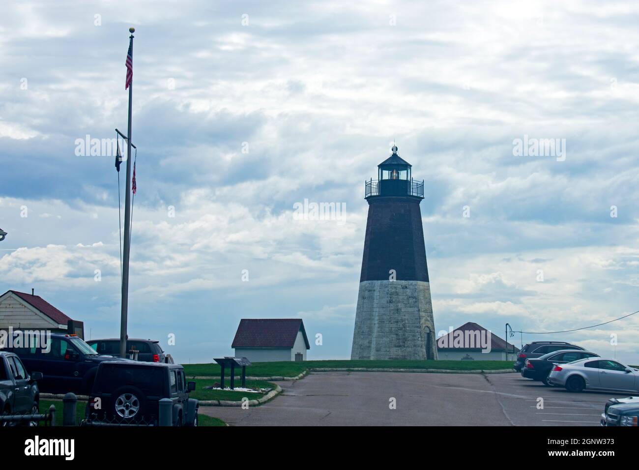 Point Judith Lighthouse with parking car parking area on a Cloudy Day