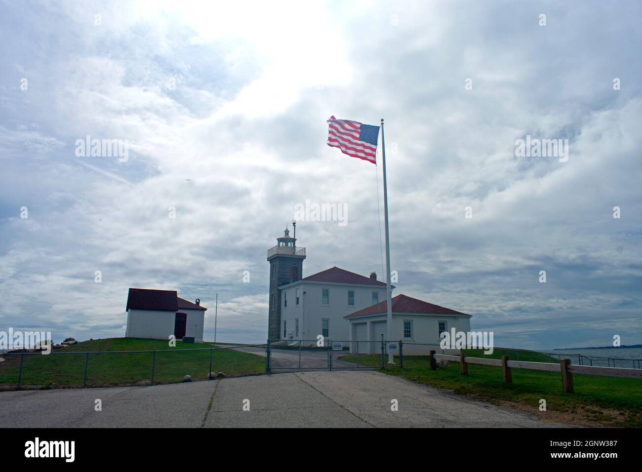 Watch Hill lighthouse in Westerly, Rhode Island, under a stormy cloudy sky -05 Stock Photo