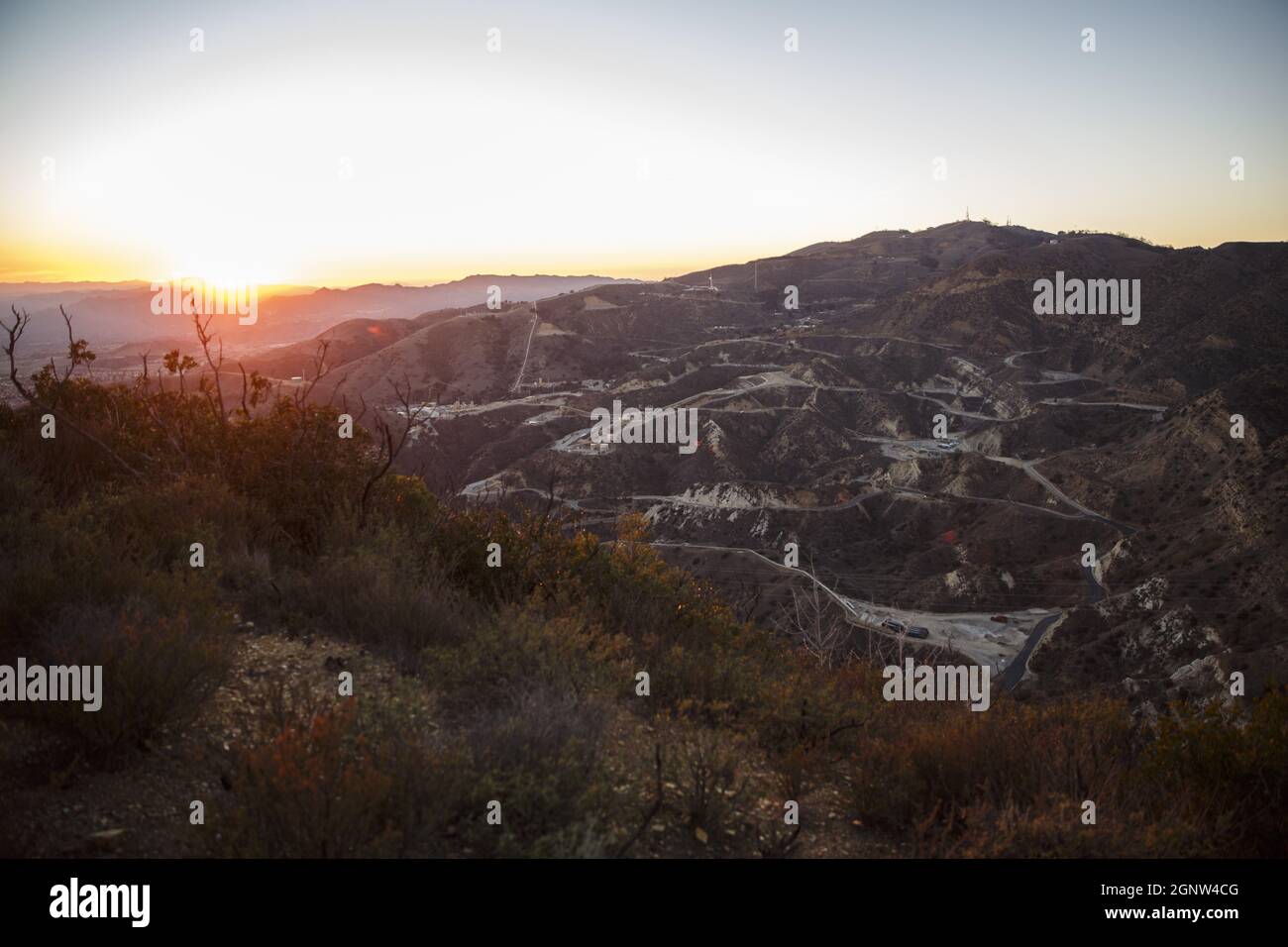 Los Angeles, California, USA. 30th Dec, 2015. The sun sets over the  SoCalGas Aliso Canyon Storage Facility, looking towards where a leaking gas  well and a relief well are being drilled, at