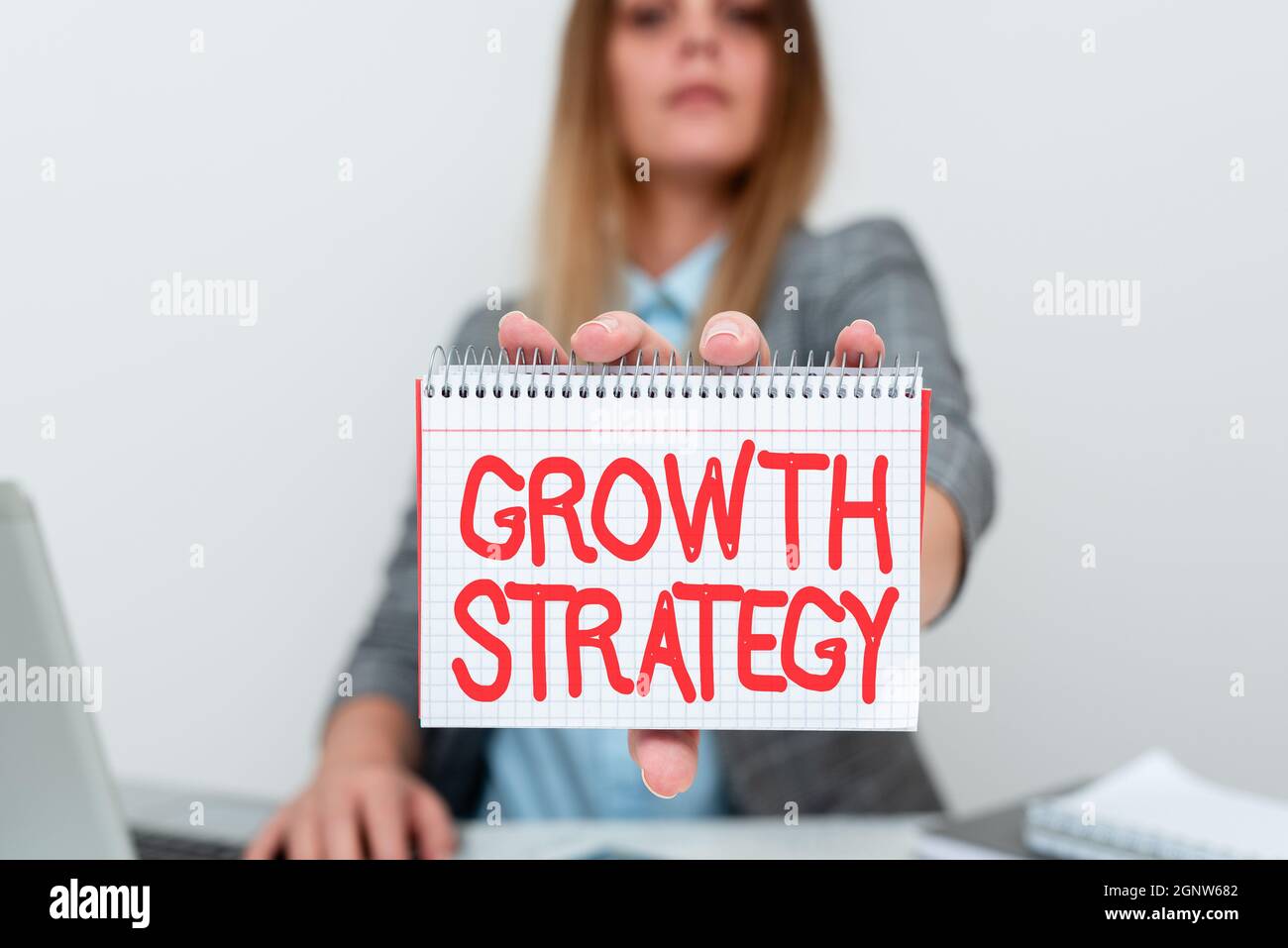 Conceptual caption Growth Strategy. Word for The method a company uses to expand its business or market Financial Advisor Giving Money Saving Tips Stock Photo