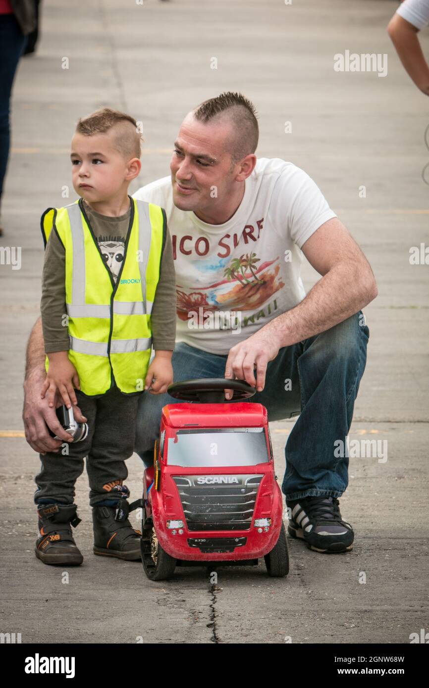 Young wannabe trucker in Hi Viz vest at a Griffin gathering, Ipswich 2014 Scania, vintage HGV trucks Stock Photo