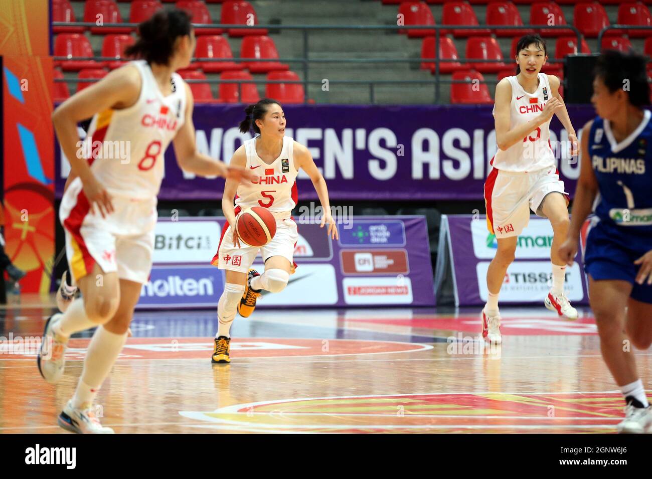 Amman Jordan. 27th Sep 2021. Wang Siyu of China 2nd L drives the ball during the FIBA Women s Asia Cup 2021 Group B basketball match between China and the Philippines in Amman