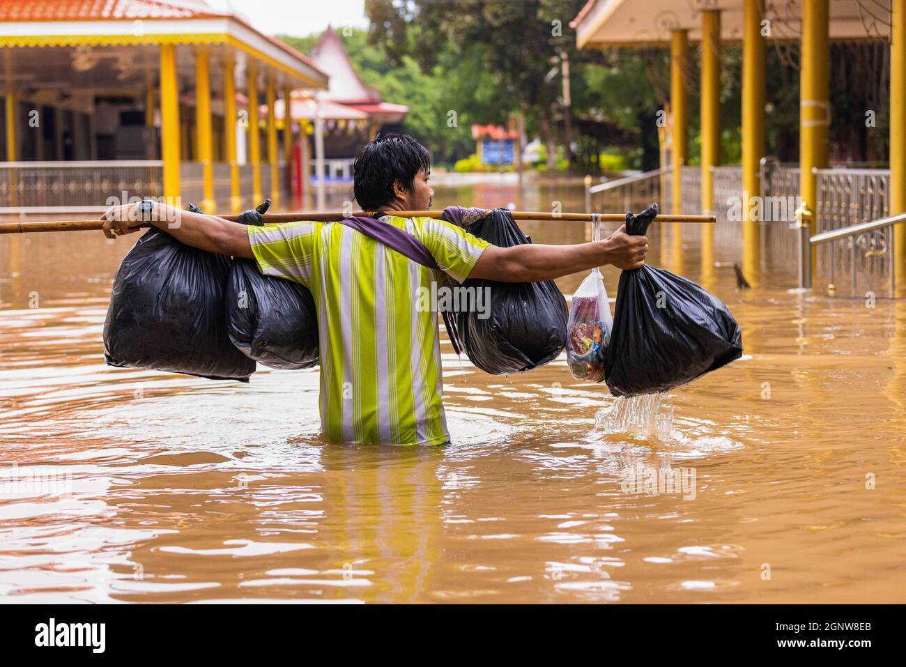 Thailand. 27th Sep, 2021. A Man Is Seen Walking On A Submerged Road ...