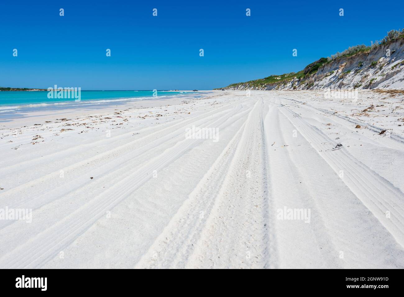 Tyre tracks on a white sand beach at Wedge, Western Australia, Australia Stock Photo