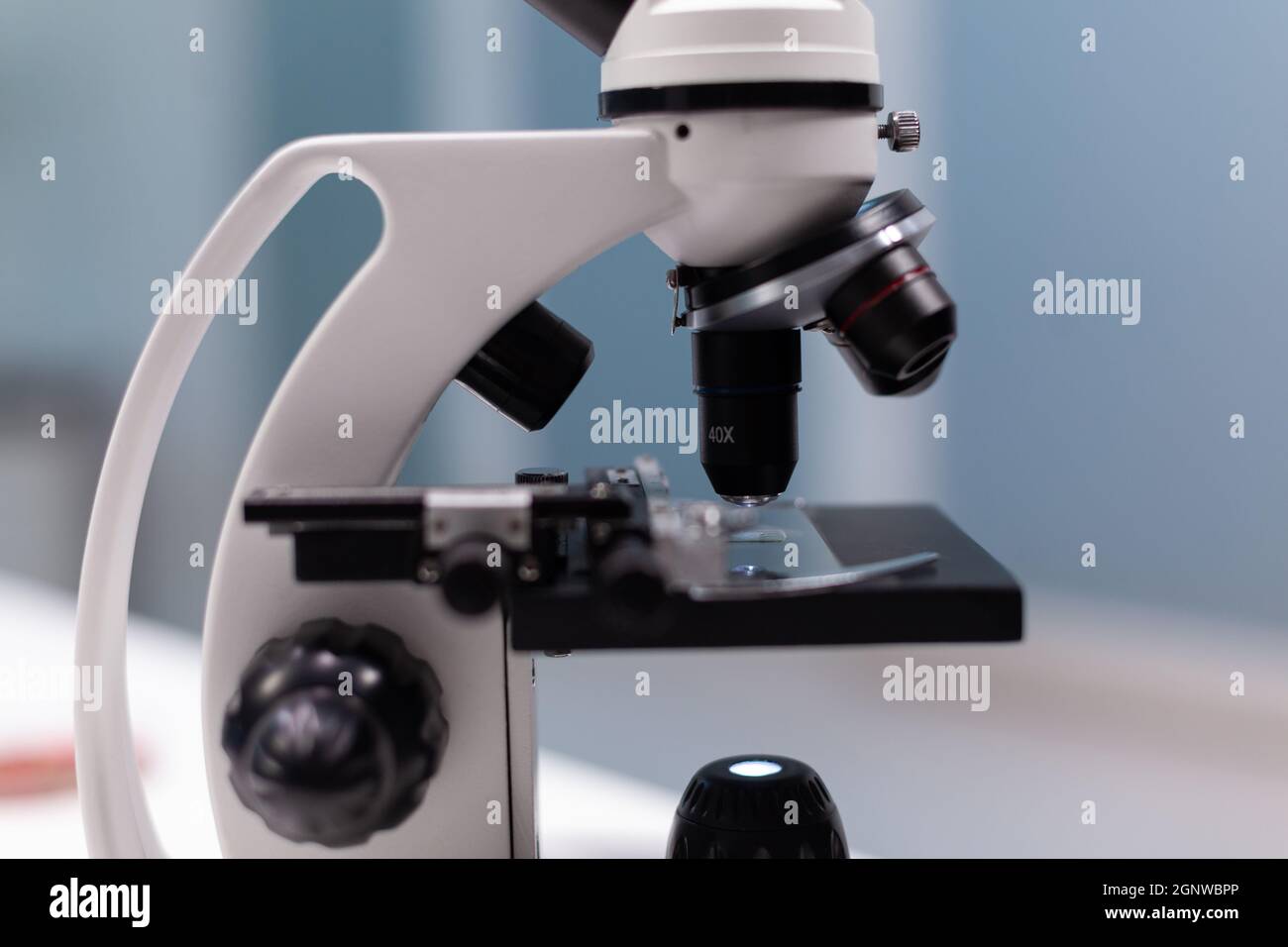 Close up of chemical microscope with magnifying glass for microbiology
