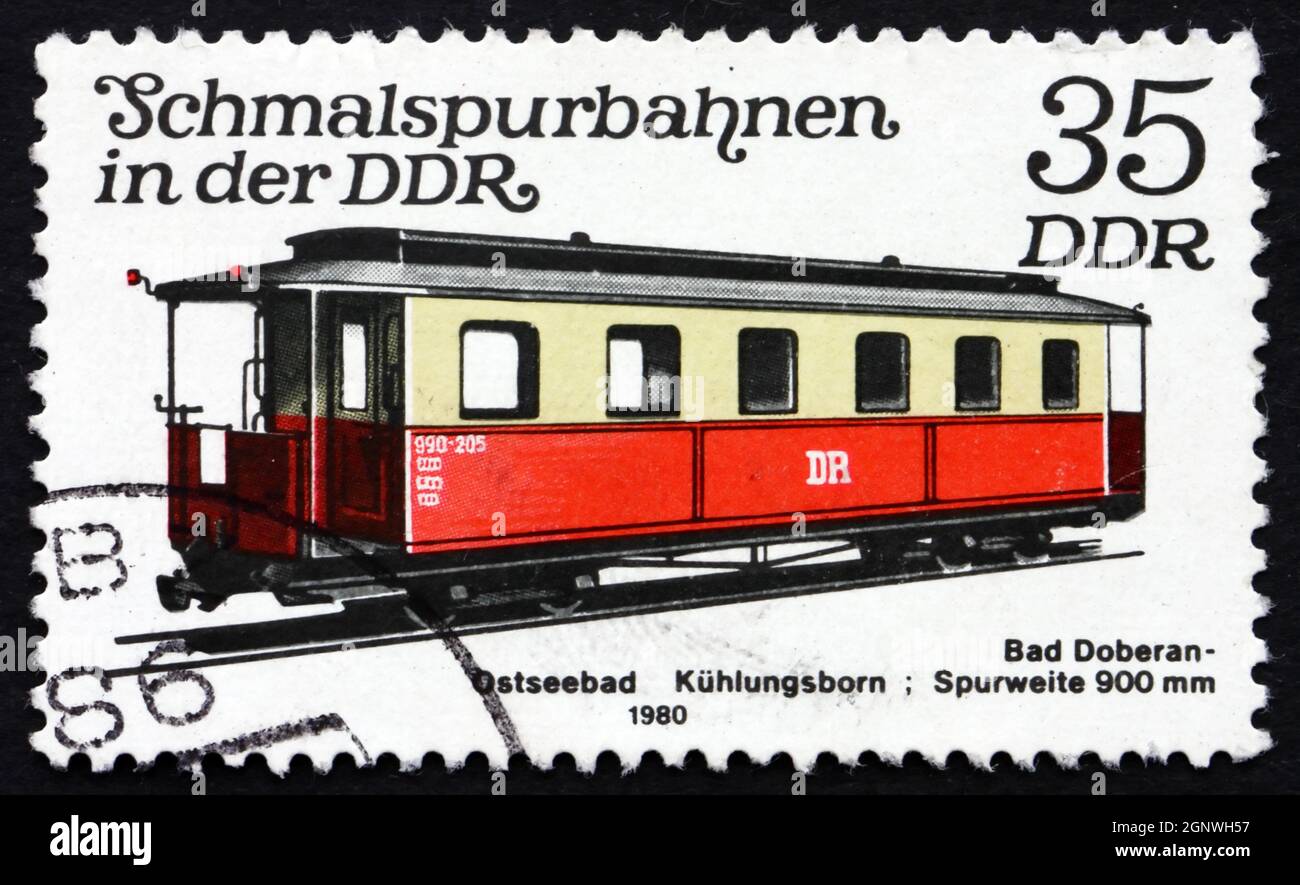 GDR - CIRCA 1980: a stamp printed in GDR shows Bad Doberan-Osteebad Kuhlungsborn Passenger Car, Light Rail, circa 1980 Stock Photo