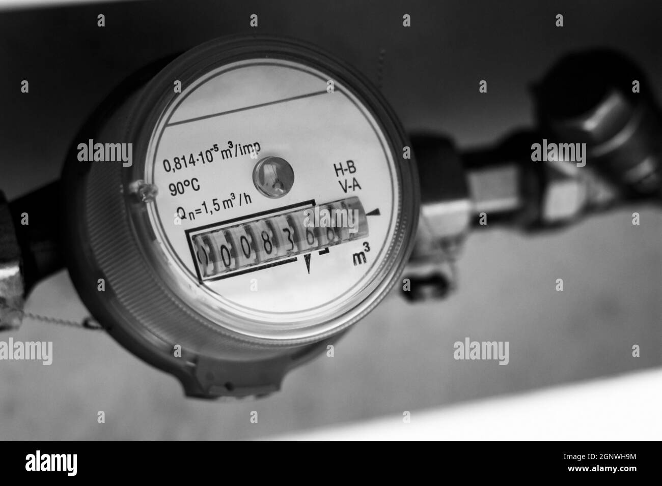 water meter and plumbing close-up black and white photography Stock Photo