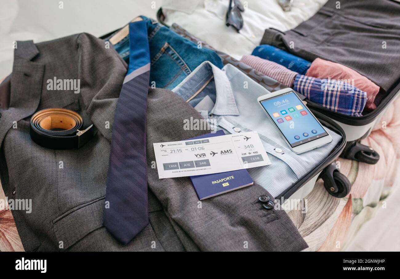 Businessman suitcase prepared for business trip Stock Photo