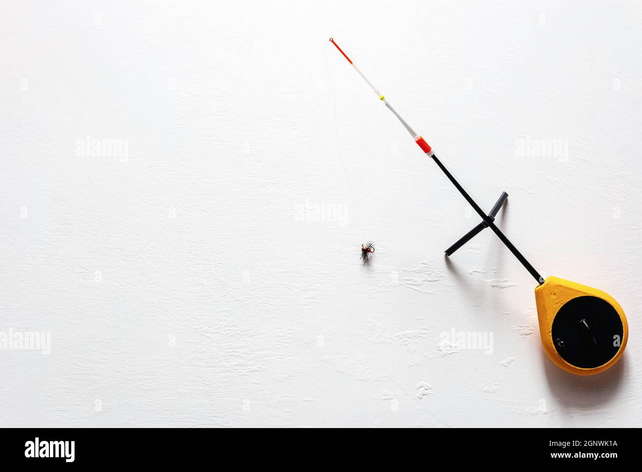 russian ice fishing rod balalaika on white background with place for
