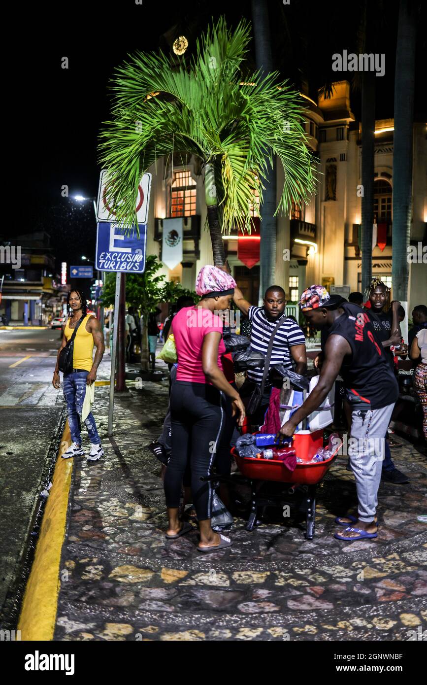 Haitian migrants sell food at Parque Central Miguel Hidalgo.In